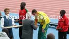 Jimmy Alder presents Michael Shelley (Australia) with his gold medal after winning the marathon, 2014 Commonwealth Games, Glasgow. Photo: David T. Hewitson/Sports for All Pics
